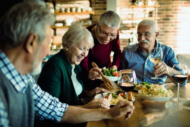 Elderly enjoying a meal in a cohabitation living arrangement